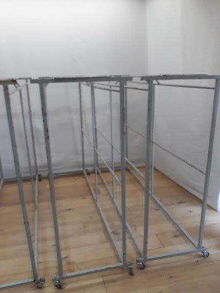 3 industrial size metal clothes hanging rails on wheels