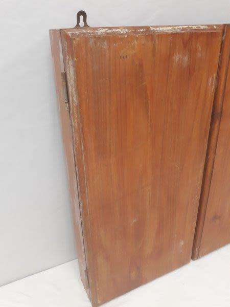 An awesome Unicorn Dart board in a wood cabinet