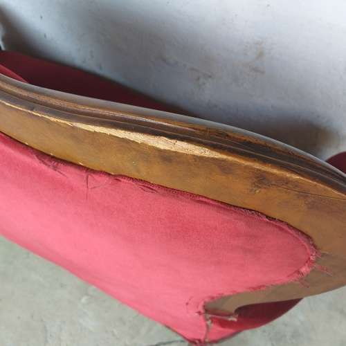 A lovely antique mid-century two-seater carved English Teak red velvet button-back sofa