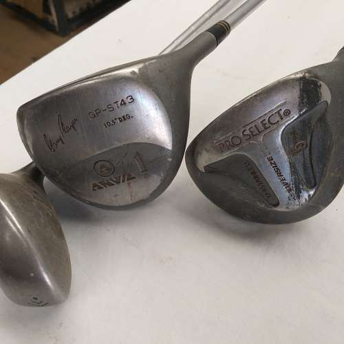 A collection of 11x assorted golf clubs, including irons, woods/ drivers and two putters