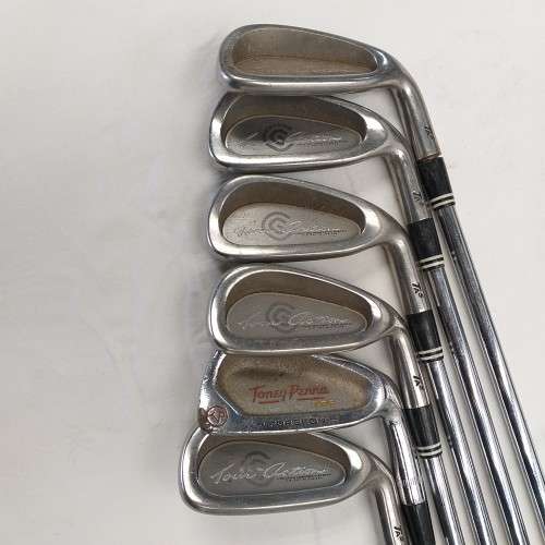 A collection of 11x assorted golf clubs, including irons, woods/ drivers and two putters