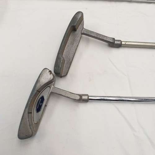 A collection of 11x assorted golf clubs, including irons, woods/ drivers and two putters
