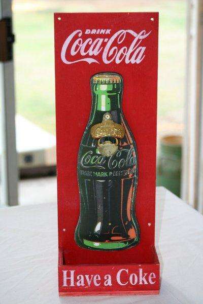 A REALLY NICE COKE BOTTLE OPENER AND DISPLAY WITH A TRAY TO CATCH THE BOTTLE CAPS...