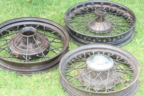 TOTALLY AWESOME VINTAGE CAR RIMS. MAKE COOL LIGHT FITTINGS? OR AS PROPS IN A GARAGE! BID PER RIM...