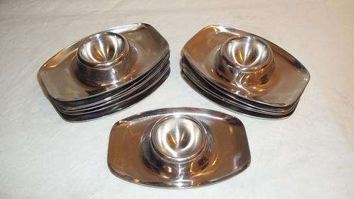AWESOME SET OF 12 STAINLESS STEEL EGG CUP HOLDERS. THESE ARE REALLY QUITE NICE AND VERY PRACTICAL