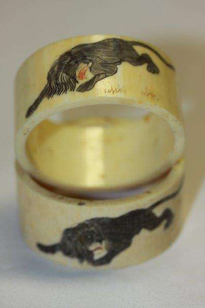 A PAIR OF EXQUISITE ANTIQUE HAND ETCHED HISTORIC IVORY NAPKIN RINGS!!! THE DETAIL IS AMAZING...