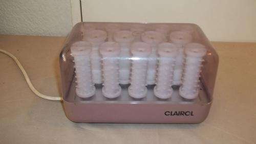 AN AWESOME SET OF VINTAGE CLAIROL HAIR CURLERS IN A HARD SEE-THROUGH CASING - A BLAST FROM THE PAST