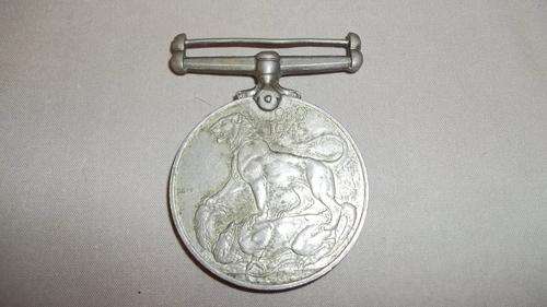 A STUNNING SILVER (800 FINE) 1939 TO 1945 WAR MEDAL ISSUED TO THE ARMED FORCES AND MERCHANT NAVY