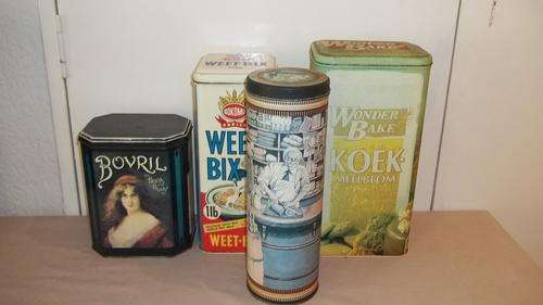AN AWESOME SET OF FOUR COLLECTIBLE TINS INCLUDING A VERY SCARCE BOVRIL TIN