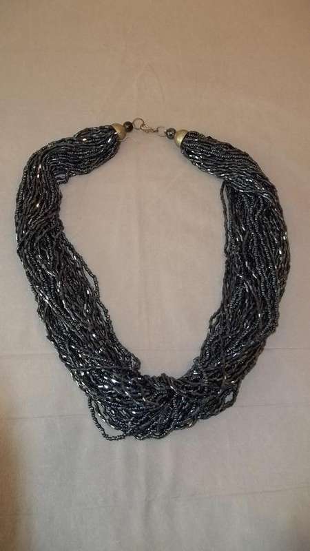 A VERY STUNNING MULTI-STRAND METALLIC BLACK GLASS BEADED LADIES NECKLACE WITH CLASP