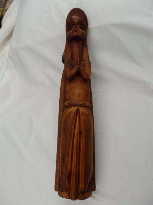 A STUNNING TALL RWANDAN WOODEN CARVING OF THE PRAYING VIRGIN MARY CALLED "OUR LADY OF KIBEHO"
