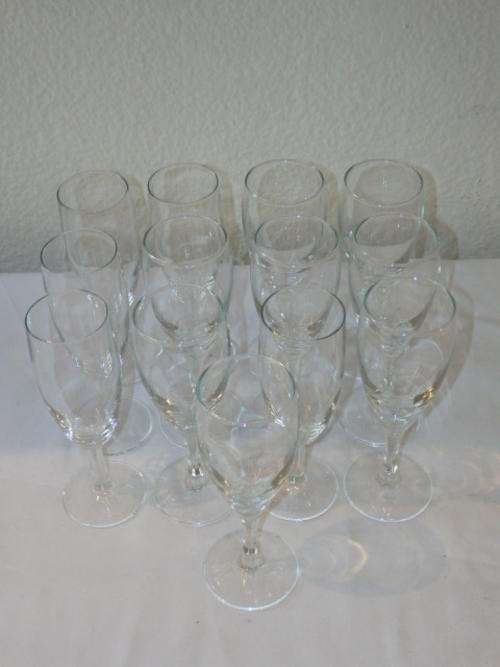AN AWESOME SET OF THIRTEEN CLEAR GLASS CHAMPAGNE GLASSES