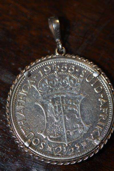 A SCARCE 1955 SOUTH AFRICA 2 1/2 SHILLING COIN SET IN A STERLING PENDANT!!! GOOD CONDITION...