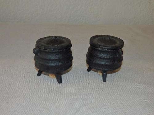 A VERY UNUSUAL BLACK CAST IRON "THREE LEGGED POT" SALT AND PEPPER SET