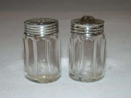 A SUPERB ENGLISH GLASS SALT AND PEPPER CELLAR SET WITH STERLING SILVER LIDS