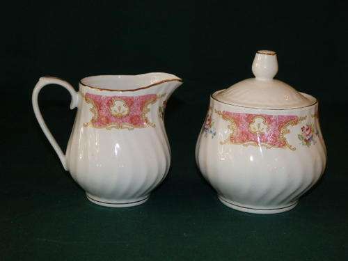 A STUNNING RICHWOOD OF USA PORCELAIN MILK JUG AND LIDDED SUGAR WITH A WILD FLOWER PATTERN