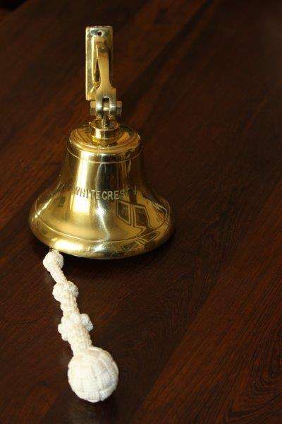 AN EXQUISITE LARGE SOLID BRASS SHIP BELL WITH KNOTTED ROPE IN PRISTINE CONDITION!!! THIS IS AWESOME