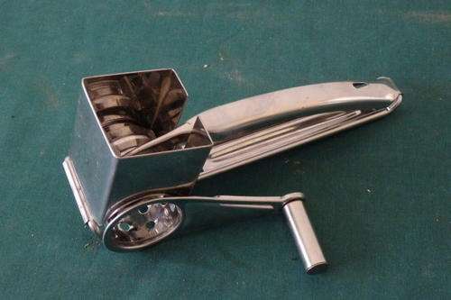 AN AWESOME SILVER METAL "HARD CHEESE" MANUAL GRATER WITH THREE DIFFERENT BLADES