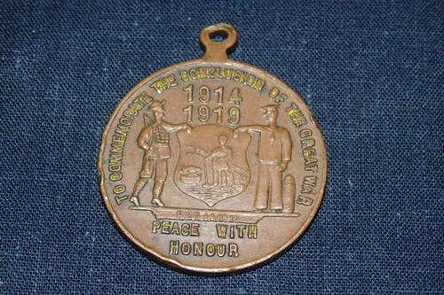 AN AWESOME ANTIQUE (1919) WW1 MEDALLION TO COMMEMORATE THE CONCLUSION OF THE GREAT WAR