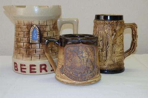 A COLLECTION OF VINTAGE PUB MEMORABILIA INCLUDING A "CASTLE BEER" PITCHER AND TWO TANKARDS