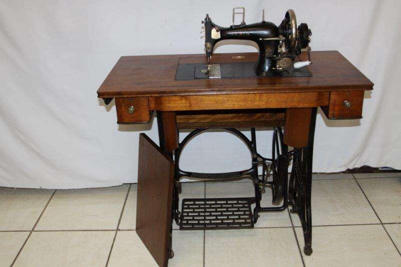 A RARE VESTA TREADLE SEWING MACHINE IN EXCELLENT CONDITION! IT STILL HAS ALL THE ORIGINAL ACCESSORIE