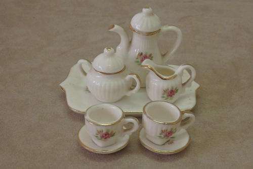 AN EXQUISITE VINTAGE HAND MADE WHITE AND GOLD PORCELAIN "DOLLS HOUSE" TEA SET WITH PINK ROSES