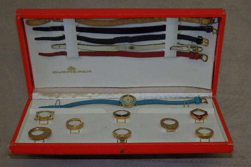 A FANTASTIC AND RARE VINTAGE (c1960's) BOXED BUCHERER GOLD PLATED INTERCHANGEABLE BEZEL WATCH SET