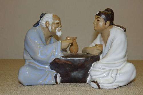 AN ABSOLUTELY STUNNING SIGNED CHINESE TERRACOTTA FIGURINE OF A MASTER AND HIS PUPIL DRINKING TEA
