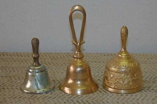 THREE AWESOME VINTAGE HAND BELLS INCLUDING TWO BRASS AND ONE SILVER PLATED BELLS