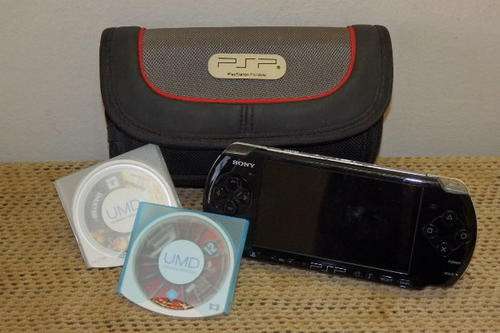 A FANTASTIC SONY PLAYSTATION "PSP" IN IT'S POUCH WITH TWO GAMES AND A POWER CABLE