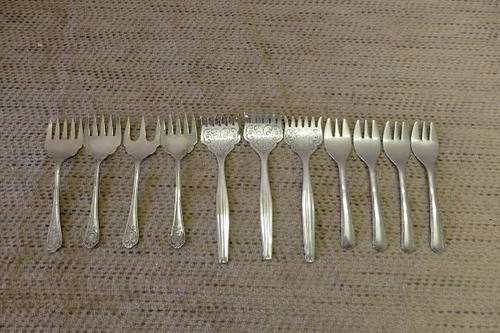 AN AWESOME SET OF ELEVEN MIXED FORKS INCLUDING BROAD FISH FORKS AND MORE