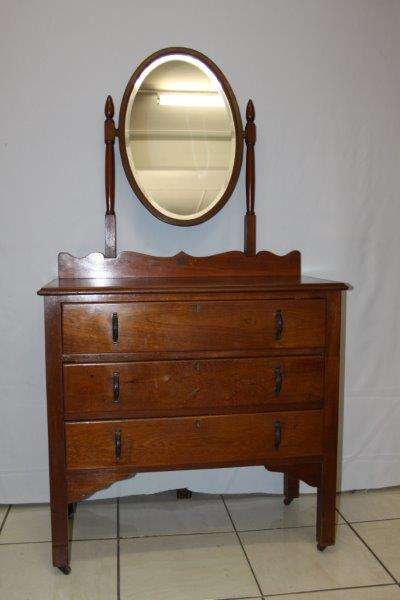 AN EXQUISITE SOLID "OLD TEAK" DRESSER ON THE ORIGINAL CASTORS WITH ORIGINAL BEVELLED OVAL MIRROR!!!