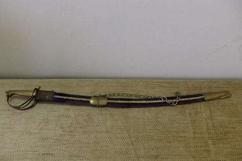 A FANTASTIC INDIAN MADE CURVED BLADE SWORD WITH A DEEP BLUE VELVET  COVERED SCABBARD AND WALL CHAIN