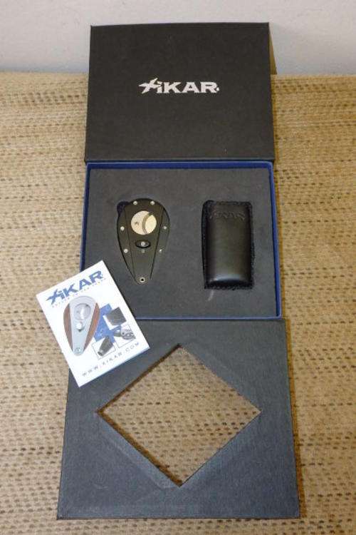 A SPECTACULAR BOXED XIKAR CIGAR CUTTER AND BUTANE LIGHTER SET WITH BOOKLET
