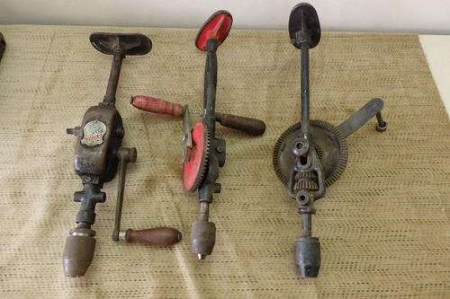 THREE AWESOME VINTAGE HAND HELD SHOULDER BRACE DRILLS WITH CHEST PLATES INCLUDING A RARE IXION DRILL