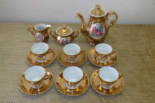 A STUNNING VINTAGE UNITY FINE CHINA GOLD DEMITASSE COFFEE SET WITH A VICTORIAN THEME