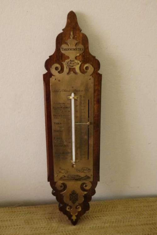 A FANTASTIC VINTAGE/ ANTIQUE BRASS "DOOR J. ADLER & COMP" THERMOMETER ON A STINKWOOD MOUNT