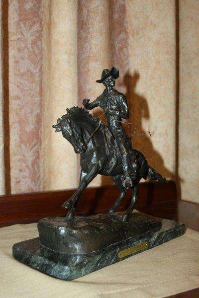 AN EXQUISITE SIGNED FREDERIC REMINGTON "THE COWBOY" BRONZE SCULPTURE IN FANTASTIC CONDITION!!!