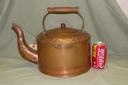 AN INCREDIBLE VINTAGE "LARGE" HAND HAMMERED COPPER KETTLE WITH A WOOD AND BRASS CARRY HANDLE