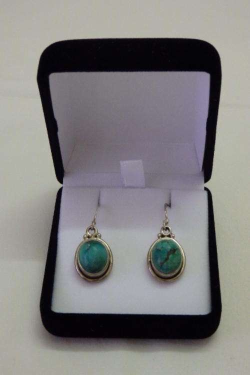 AN INCREDIBLE PAIR OF STERLING SILVER LADIES EARRINGS WITH TWO STUNNING TURQUOISE STONES