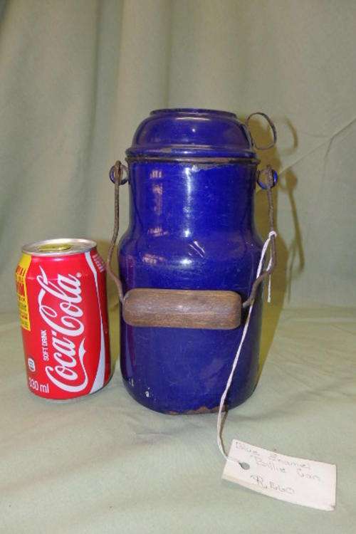 AN INCREDIBLE VINTAGE/ ANTIQUE DARK BLUE ENAMELWARE BILLY CAN WITH A CUP AND WOODEN HANDLE