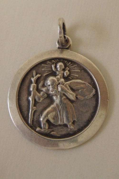 A STUNNING ROUND SILVER ST. CHRISTOPHER (PATRON SAINT OF TRAVEL) PENDANT
