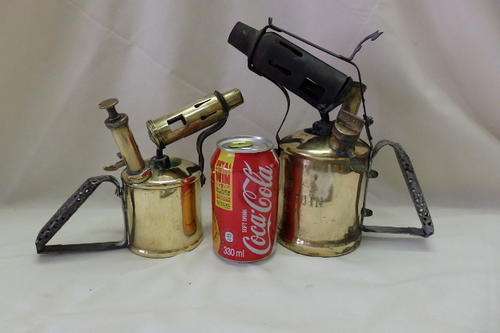 TWO INCREDIBLE VINTAGE BRASS PARAFFIN BLOW LAMPS INCLUDING A RARE PRIMUS 630 AND AN ORIGINAL PENGUIN
