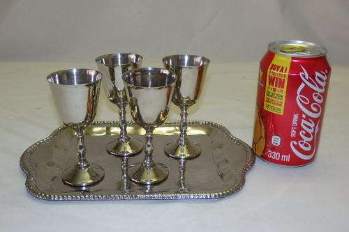 A FABULOUS SET OF FOUR SILVER PLATED SHERRY GOBLETS ON AN ENGRAVED TRAY