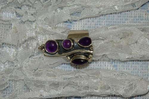 A REMARKABLE AND VERY UNUSUAL STERLING SILVER LADIES RING WITH FOUR AMETHYST STONES