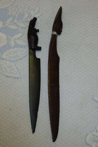 TWO FANTASTIC HAND CARVED LETTER OPENERS INCLUDING A TEAK CARVED HEAD AND A BLACKWOOD HIPPO