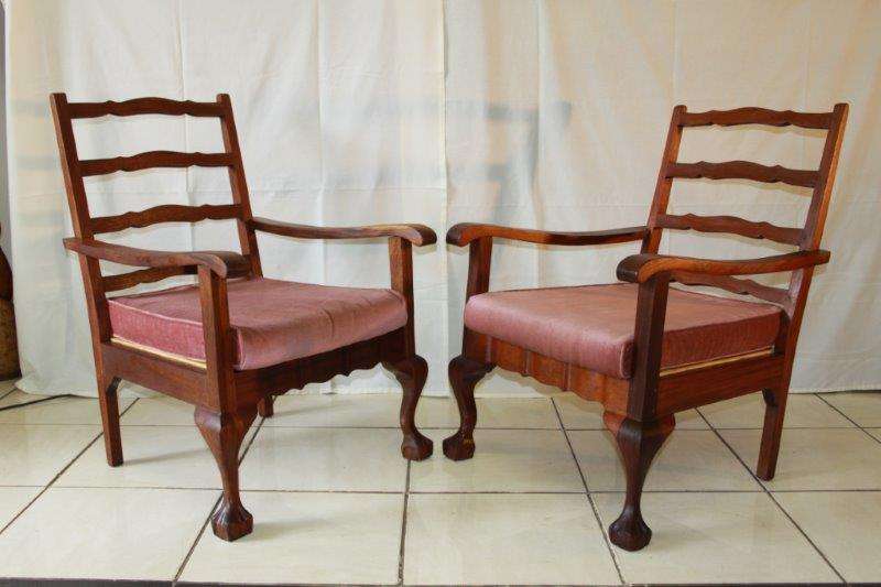 WOW!!! AN EXQUISTE PAIR OF ANTIQUE SOLID AFRICAN BLACK WOOD CARVED BALL & CLAW CHAIRS! bid/chair