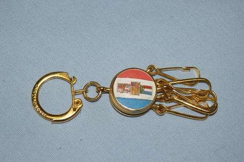 A VERY UNUSUAL VINTAGE (OLD) SOUTH AFRICAN KEY HOLDER WITH A ST. CHRISTOPHER & THE OLD RSA FLAG