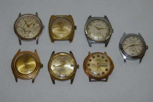 AN AWESOME COLLECTION OF SEVEN DIFFERENT VINTAGE MENS WATCH FACES FOR RESTORATION OR PARTS bid/watch