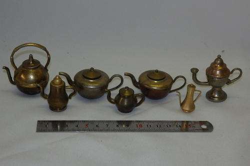 AN AWESOME COLLECTION OF SEVEN MIXED BRASS DOLLS HOUSE ORNAMENTAL BEVERAGE POTS bid/item
